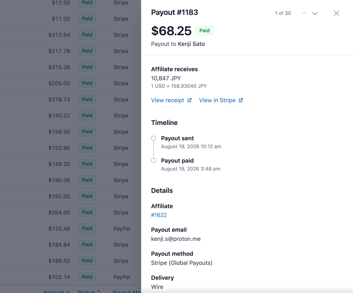 A gaveta de pagamento no AffiliateWP para um pagamento de Pagamentos Globais para Kenji Sato, mostrando 10.847 JPY creditados, a taxa de câmbio, um cronograma de Pagamento enviado e Pagamento pago, e Entrega por transferência bancária